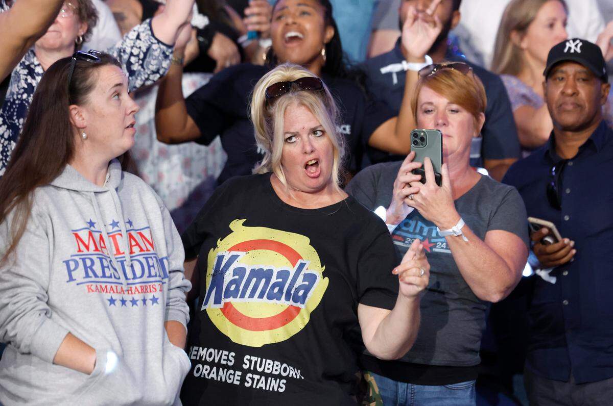 Supporters sing along during a rally for Vice President and democratic nominee for president Kamala Harris at the Greensboro Coliseum in Greensboro, N.C., Thursday, Sept. 12, 2024.