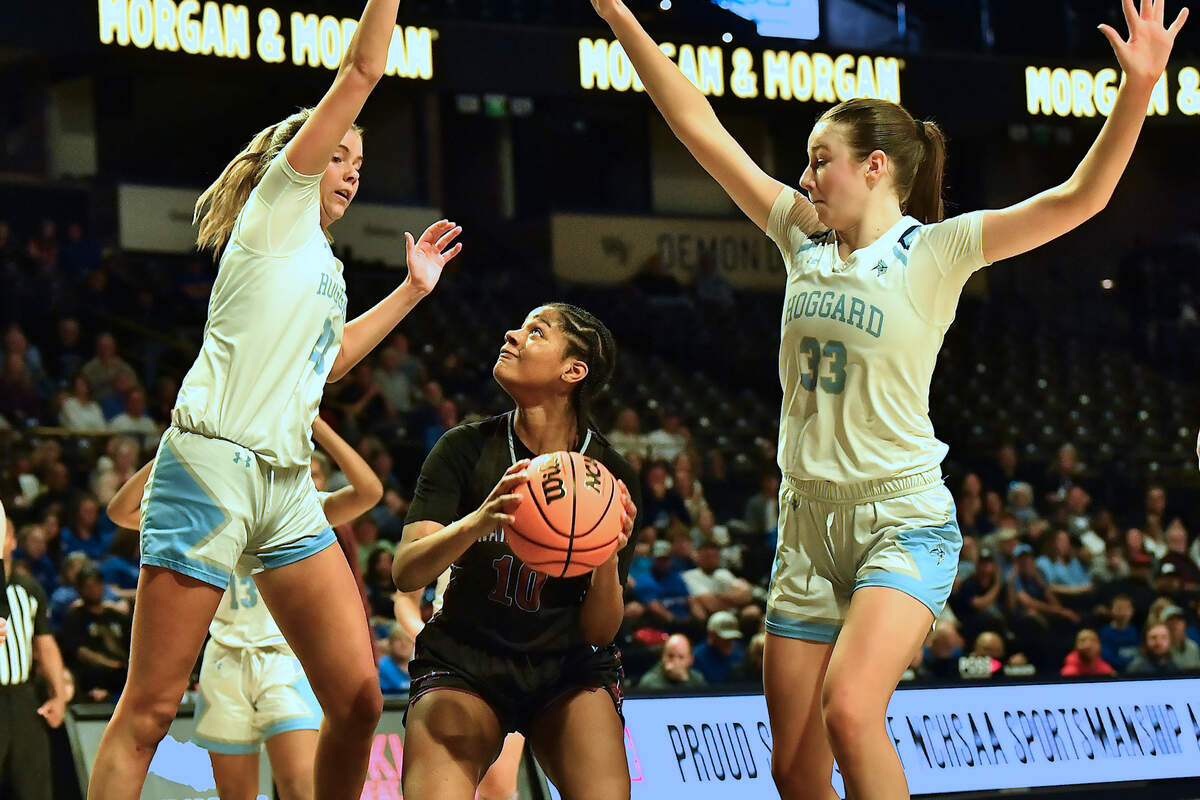 Wakefield’s Jaya Hamilton (10) looks to shoot against Hoggard’s Ella Jones (33) and Avery Fitzgerald (23) during the second half. The Wakefield Wolverines and the Hoggard Vikings met in the NCHSAA 4A East Regional Final in Winston-Salem, N.C. on March 12, 2025. Wakefield wins 31-23.