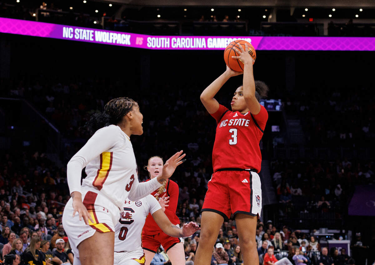 N.C. State’s Zamareya Jones shoots over South Carolina’s Sakima Walker during the second half of the Wolfpack’s 71-57 loss on Sunday, Nov. 10, 2024, at Spectrum Center in Charlotte, N.C.