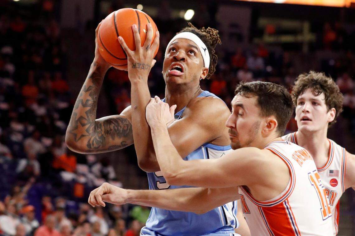 North Carolina’s Armando Bacot (5) is fouled by Clemson’s Alex Hemenway (12) during the second half of UNCs 79-77 victory over Clemson at Littlejohn Coliseum in Clemson, S.C., Tuesday, Feb. 8, 2022.