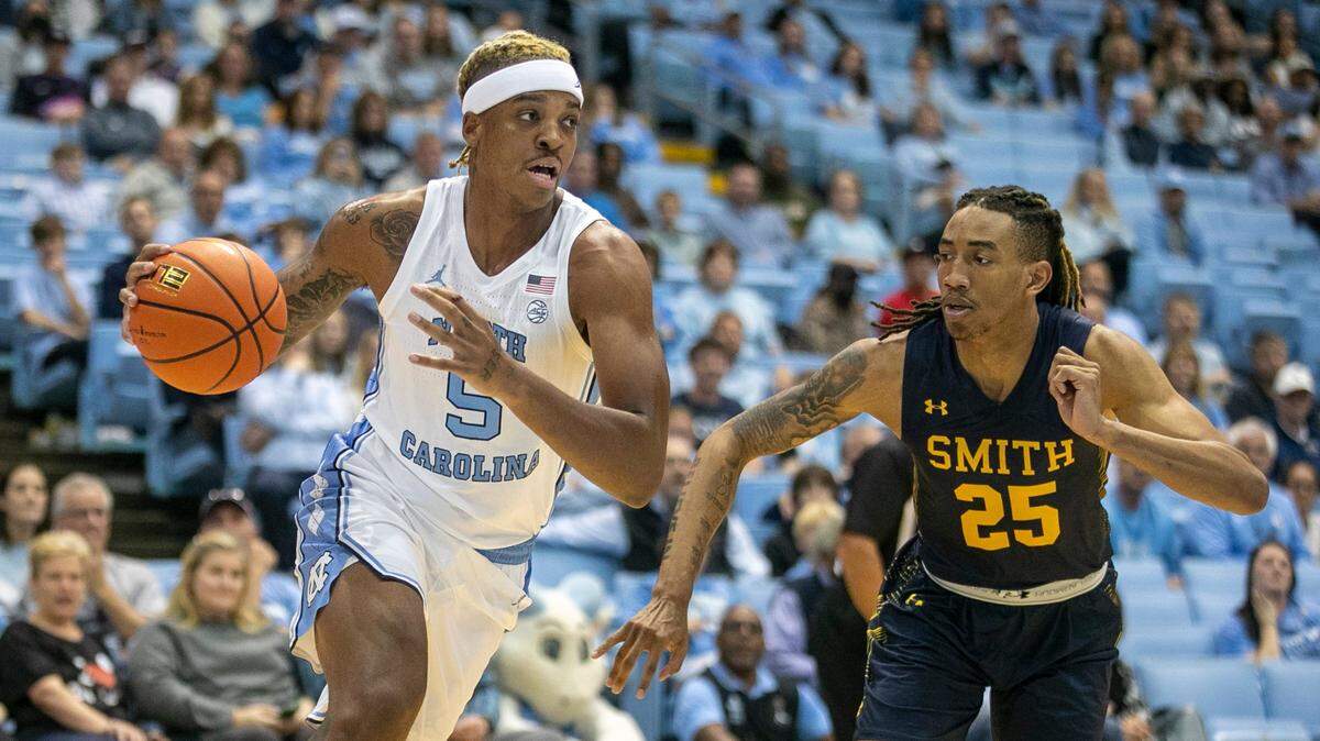 North Carolina’s Armando Bacot (5) drives to the basket against Johnson C. Smith’s Jataveous Watson (25) in the first half during an exhibition game on Friday, October 28, 2022 at the Smith Center in Chapel Hill, N.C. Bacot scored 12 points and had 20 rebounds.