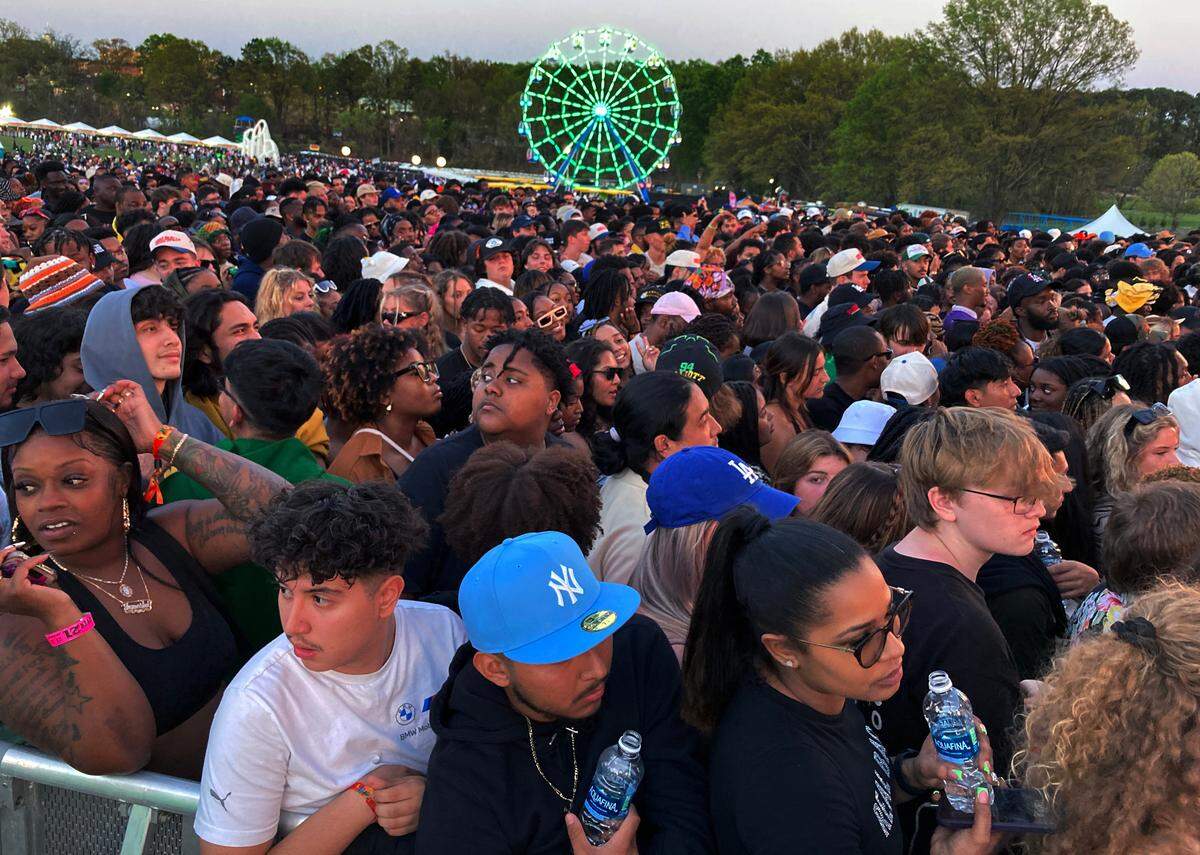 Fans wait for a set to start at the Rise Stage at the Dreamville Festival in Raleigh, N.C., Saturday, April 1, 2023.