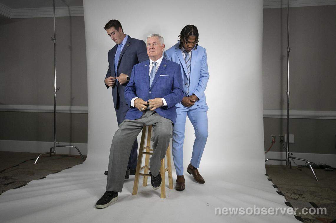North Carolina coach Mack Brown along with offensive tackle Charlie Heck, left and safety Myles Dorn pose during a photo shoot for the ACC Social Media group on Thursday morning July 18, 2019 during the ACC Kickoff at the Westin in Charlotte, N.C.