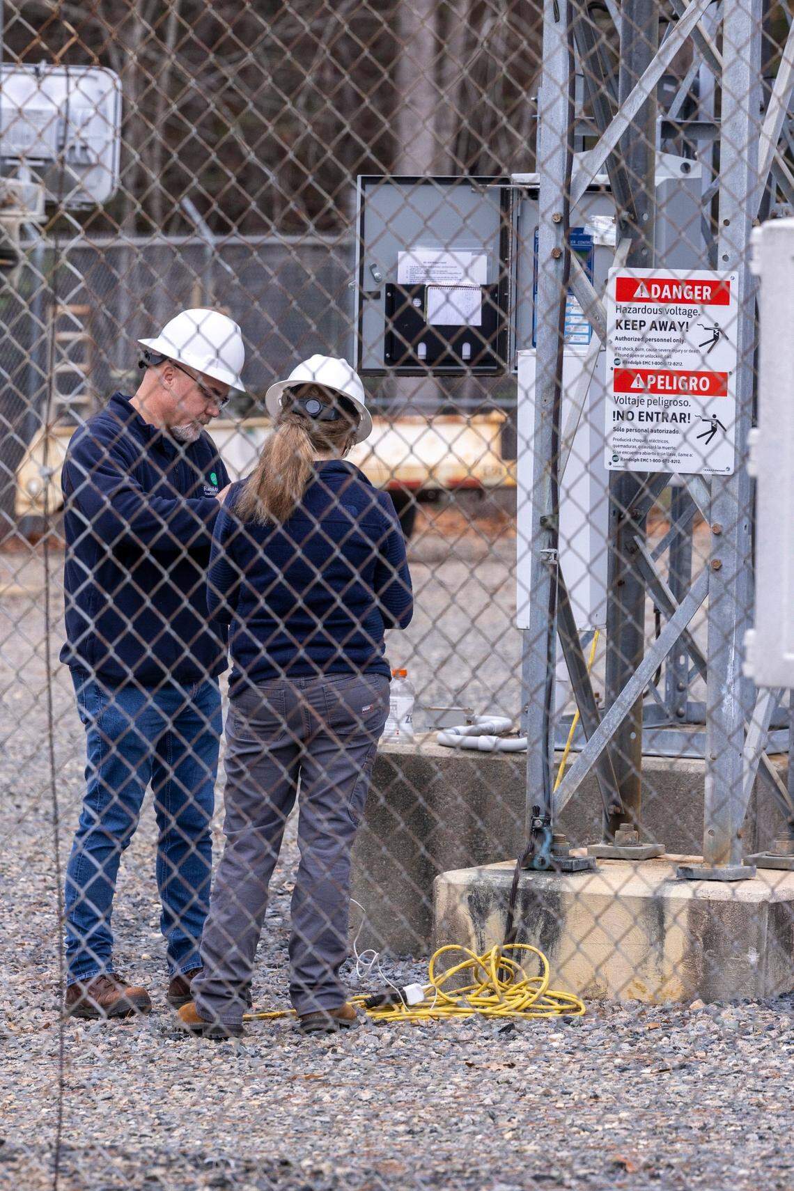 Workers with Randolph Electric Membership Corporation work to repair the Eastwood Substation in West End Tuesday, Dec. 6, 2022. Two deliberate attacks on electrical substations in Moore County Saturday evening caused days-long power outages for tens of thousands of customers.