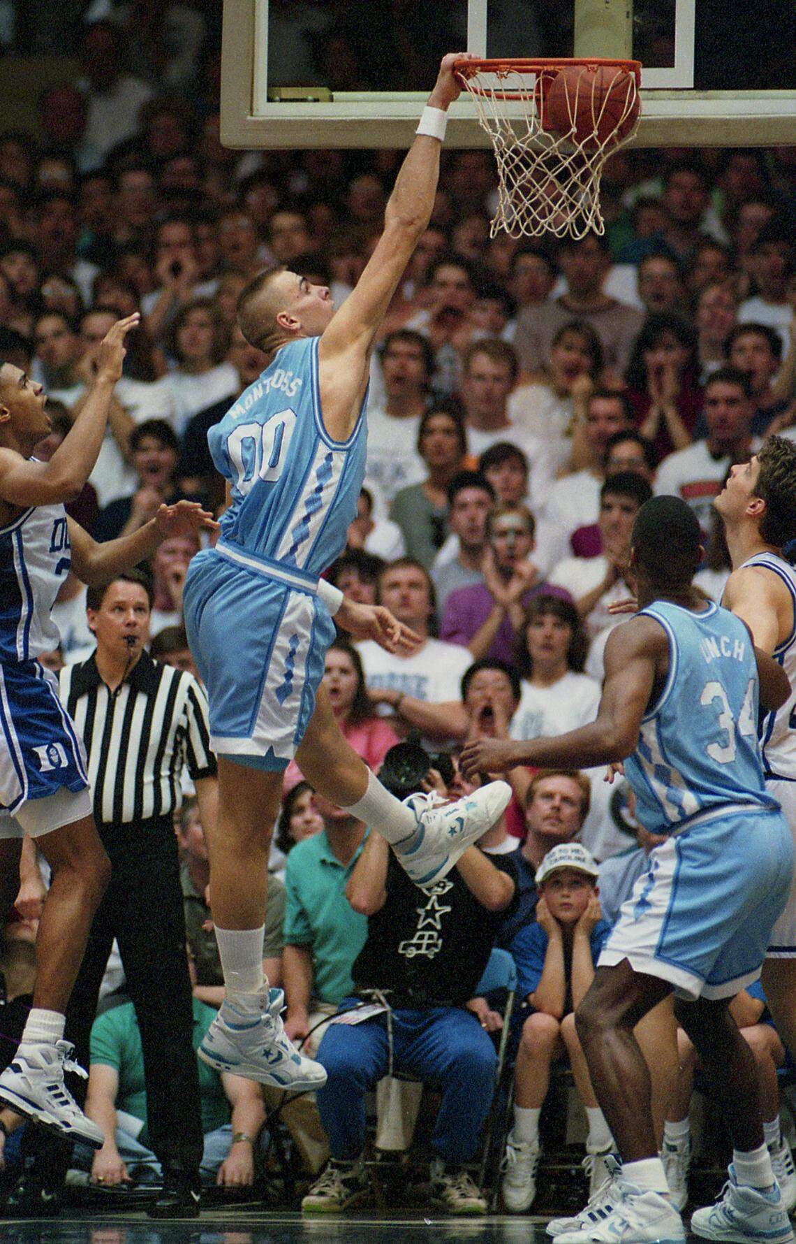 UNC center Eric Montross dunks in action against Duke in Cameron Indoor Stadium.