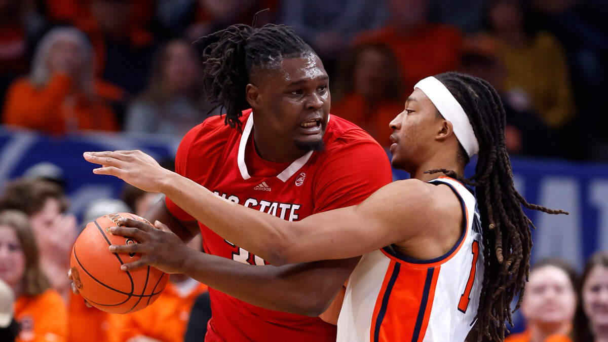 N.C. State’s DJ Burns Jr. (30) works against Syracuse’s Kyle Cuffe Jr. (0) during the first half of N.C. State’s game against Syracuse in the second round of the 2024 ACC Men’s Basketball Tournament at Capital One Arena in Washington, D.C., Wednesday, March 13, 2024.