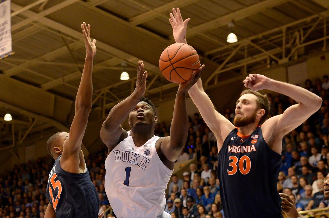 Duke’s Zion Williamson attempts a first half shot as Virginia’s Mamadi Diakite (25) and Jay Huff (30) at Cameron Indoor Stadium In Durham, N.C., Saturday, Jan. 19, 2019.