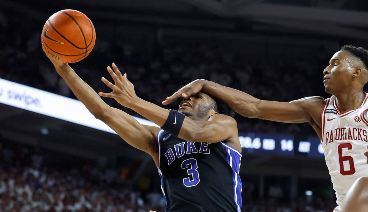 Duke’s Jeremy Roach (3) is fouled by Arkansas’ Layden Blocker (6) during the first half of Duke’s game against Arkansas at Bud Walton Arena in Fayetteville, Ark., Weds. Nov. 29, 2023.