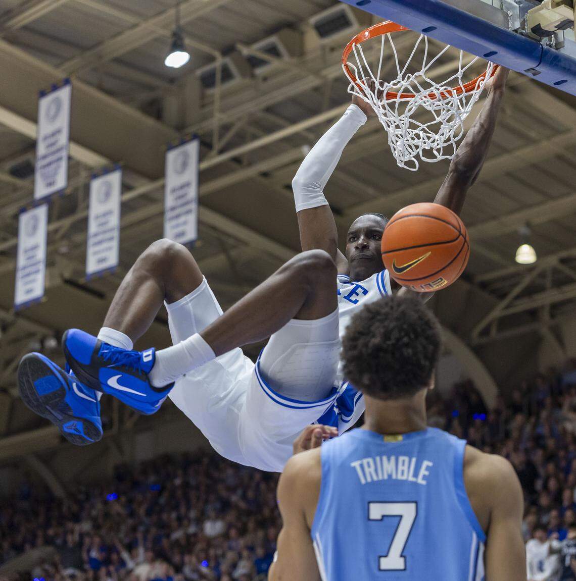 Duke forward Dame Sarr (7) breaks to the basket for a dunk against North Carolina guard Seth Trimble (7) in the first half on Saturday, March 7, 2026 at Cameron Indoor Stadium in Durham, N.C.