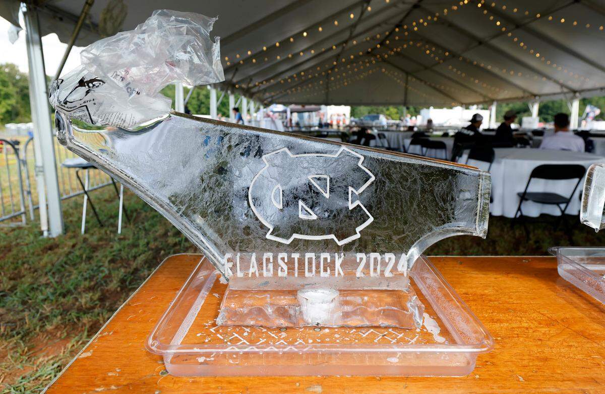 An ice luge sits in the VIP section at “Flagstock 2024,” an invite-only concert featuring country musicians Big & Rich and Lee Greenwood, among others, at a location in Chapel Hill, N.C., Monday, Sept. 2, 2024. Flagstock started after a GoFundMe raised over $515,000 for a “rager” for UNC-Chapel Hill fraternity brothers who held up the American flag during an April campus protest.