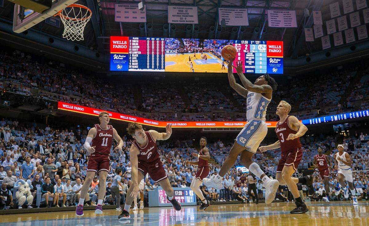 North Carolina’s Caleb Love (2) puts up a shot against College of Charleston’s Reyne Smith (2) during the first half on Friday, November 11, 2022 at the Smith Center in Chapel Hill, N.C. Love scored 25 points in the Tar Heels’ victory.