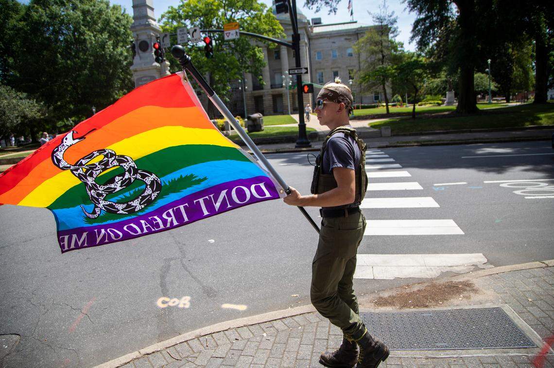 Benjamin Ryan Teeter, who is affiliated with the Facebook group Blue Igloo, marches near the State Capitol in Downtown Raleigh Saturday, May, 16, 2020.