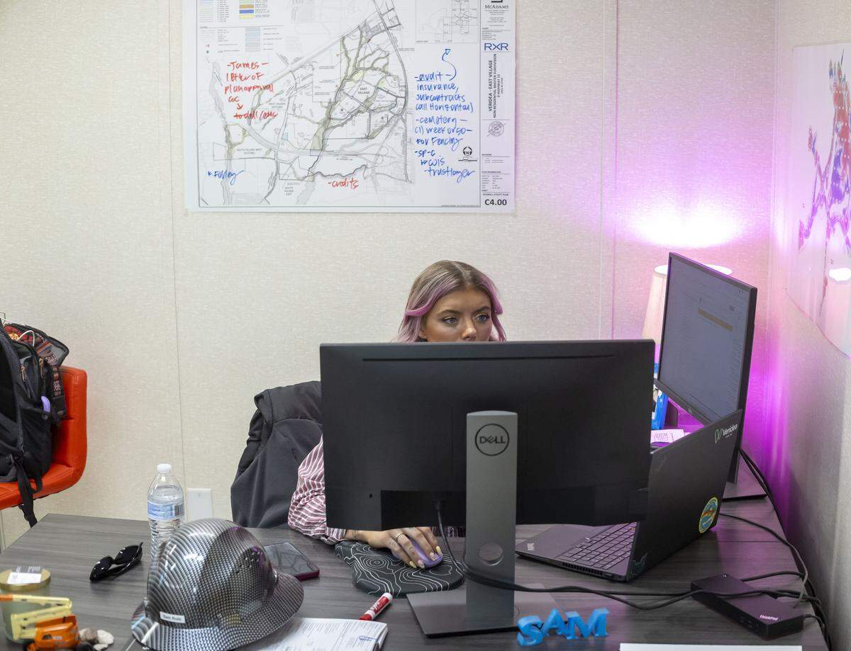 Project Manager Sam Roth works in her office at the Veridea mixed use development on Tuesday, April 28, 2026 in Apex, N.C. in Apex, N.C.
