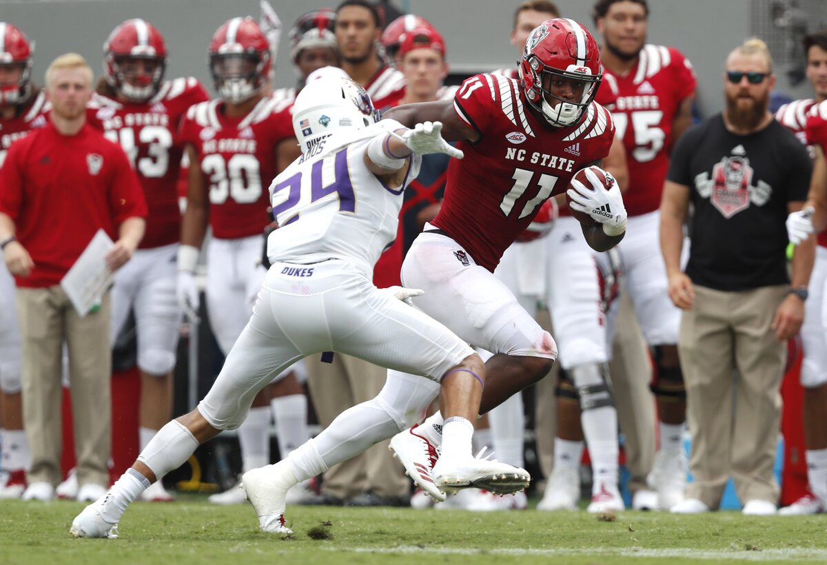 N.C. State wide receiver Jakobi Meyers (11) tries to beat JMU safety D’Angelo Amos (24) on a 39-yard reception during the second half of N.C. State’s 24-13 victory over James Madison at Carter-Finley Stadium in Raleigh, N.C., Saturday, Sept. 1, 2018.