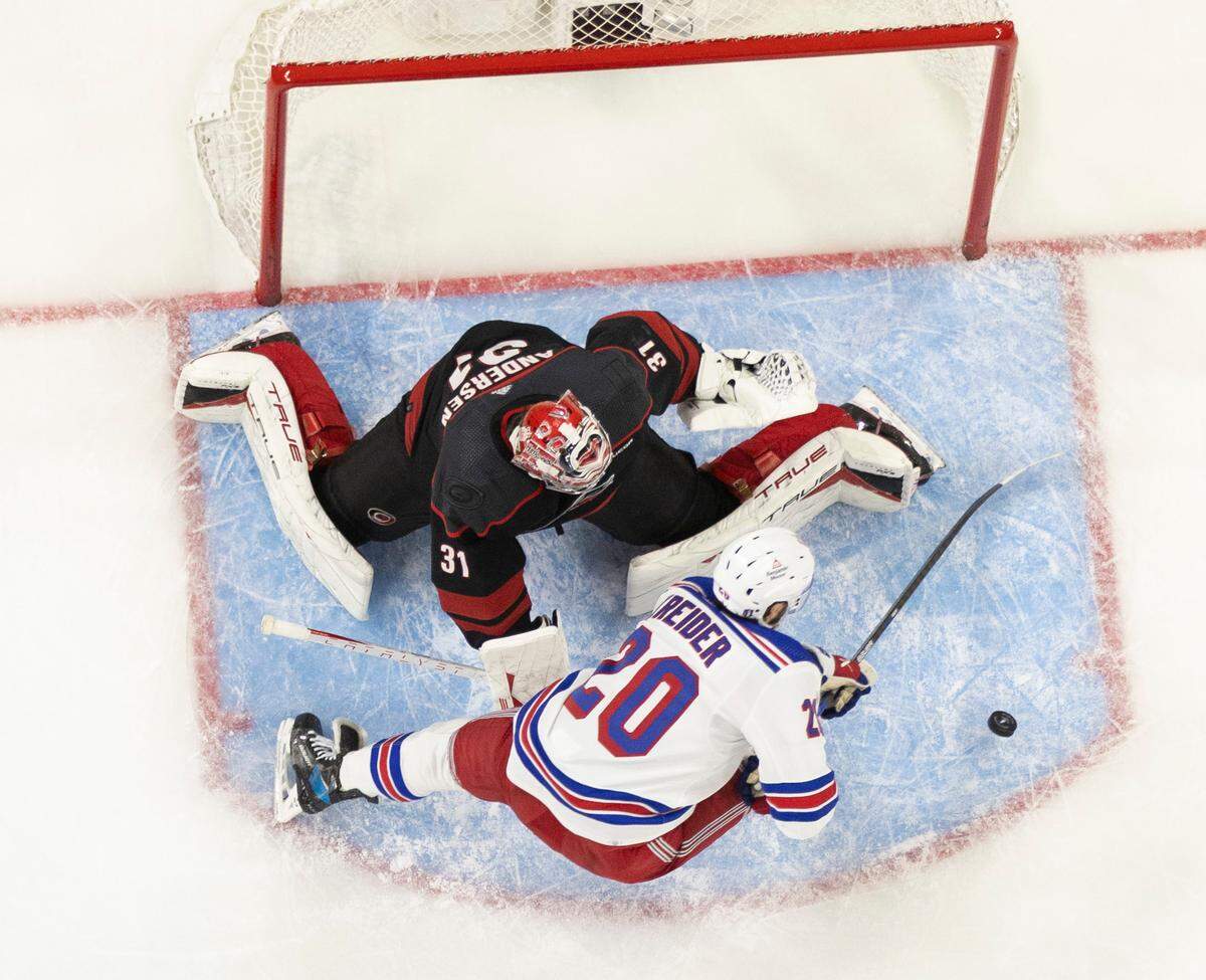 New York Rangers left wing Chris Kreider (20) works against Carolina Hurricanes goaltender Frederik Andersen (31) in the third period during Game 6 of the second round of the 2024 Stanley Cup playoffs on Thursday, May 16, 2024 at PNC Arena in Raleigh N.C.