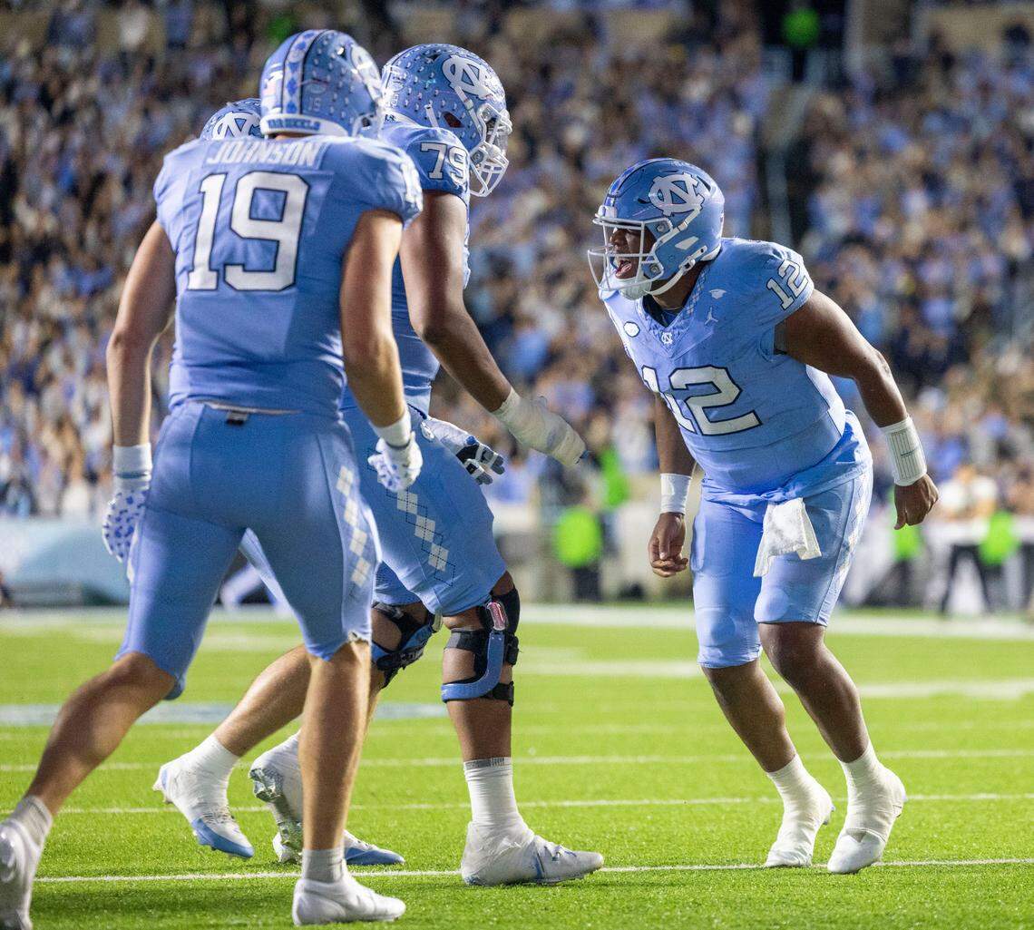 North Carolina quarterback Jacolby Criswell (12) reacts after scoring on a 4-yard run to give the Tar Heels a 7-3 lead in the second quarter on Saturday, November 16, 2024 at Kenan Stadium in Chapel Hill, N.C.