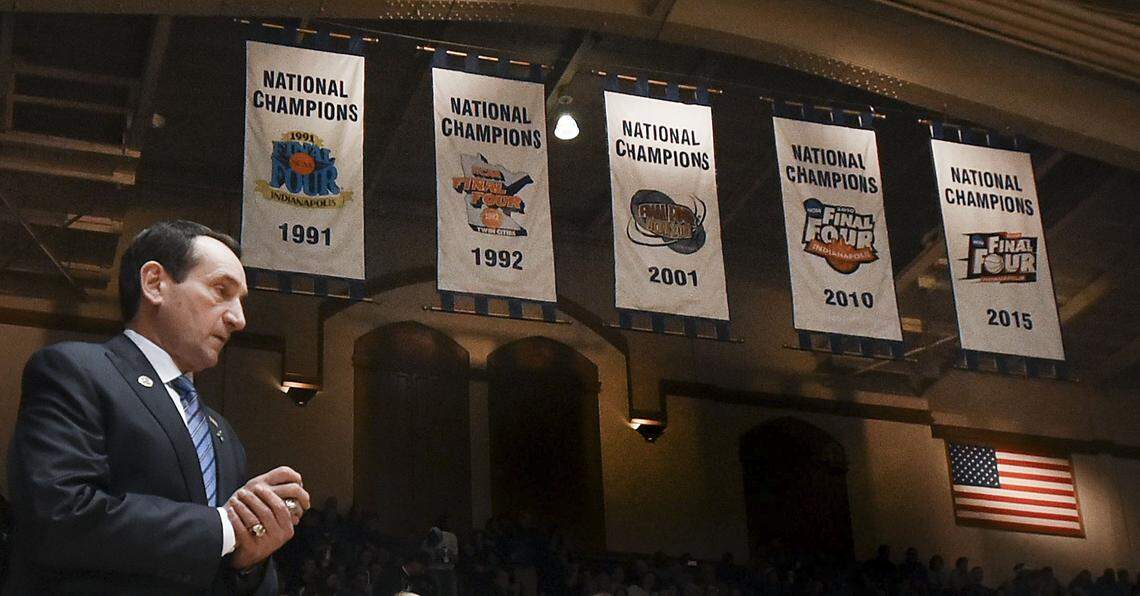 Duke head coach Mike Krzyzewski walks out to the court with the Blue Devils’ National Championship banners in the background in 2015.