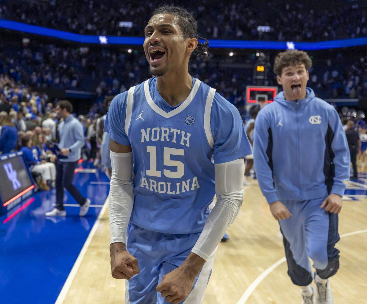 North Carolina forward Jarin Stevenson (15) and forward John Holbrook (25) celebrate the Tar Heels’ 67-64 victory over Kentucky on Tuesday, December 2, 2025 at Rupp Arena in Lexington, Ky.