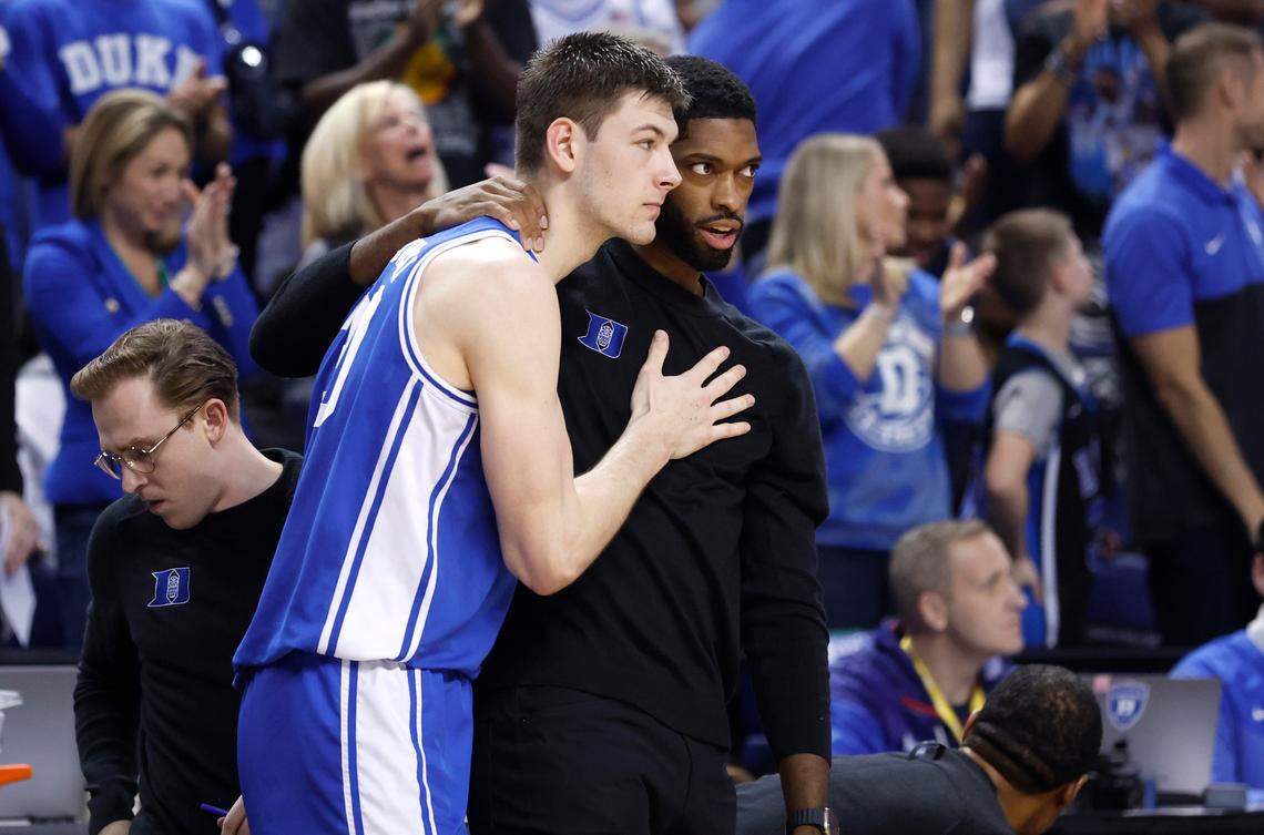 Duke assistant coach Amile Jefferson talks with Kyle Filipowski (30) late in the second half of Duke’s 59-49 victory over Virginia to win the ACC Men’s Basketball Tournament in Greensboro, N.C., Saturday, March 11, 2023.