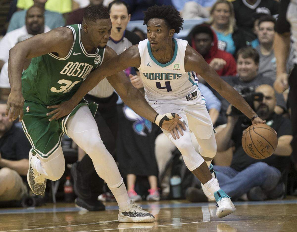 Devonté Graham (right) is hoping to get more minutes at point guard with the Charlotte Hornets.