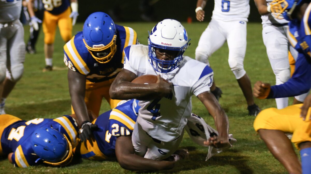 Clayton receiver Jaylen Emory (4) dives ahead for a first down in a week one contest with Garner. Clayton will host South Johnston in a conference match up tonight.