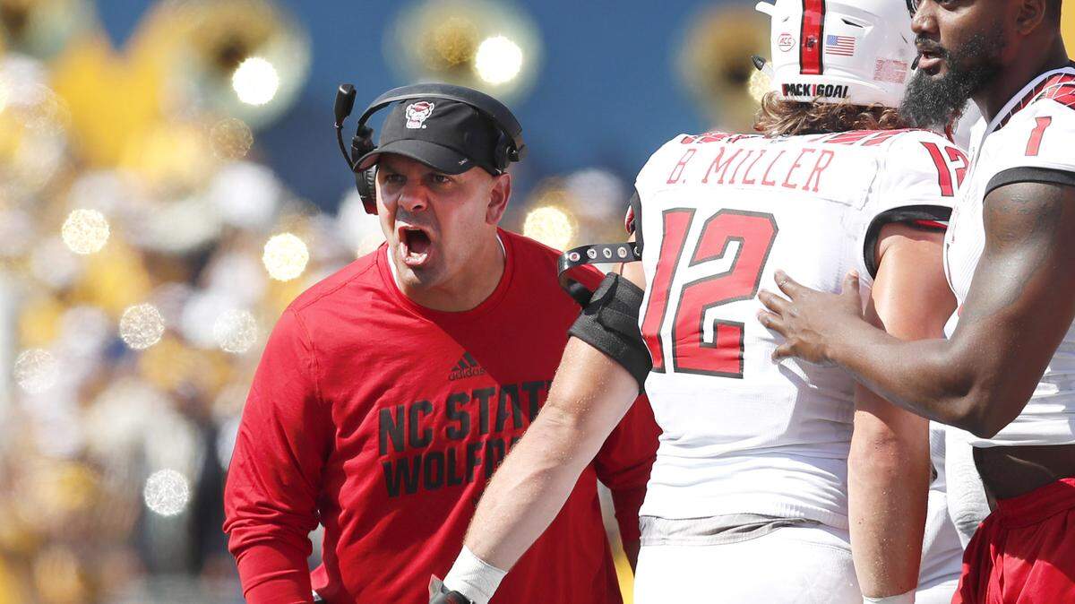 N.C. State co-defensive coordinator Tony Gibson yells to the team during the second half of West Virginia’s 44-27 victory over N.C. State at Milan Puskar Stadium in Morgantown, W.V., Saturday, Sept. 14, 2019.