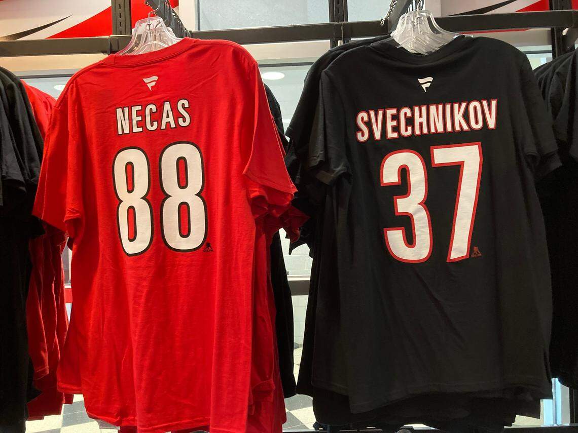 Carolina Hurricanes forwards Martin Necas and Andrei Svechnikov are playing on the same line and their merchandise also is side by side in the team store at PNC Arena.