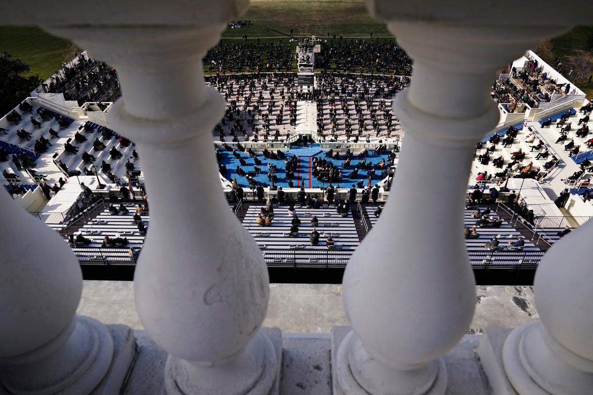 Guests and spectators attend the 59th Presidential Inauguration for President Joe Biden at the U.S. Capitol in Washington, Wednesday, Jan. 20, 2021.