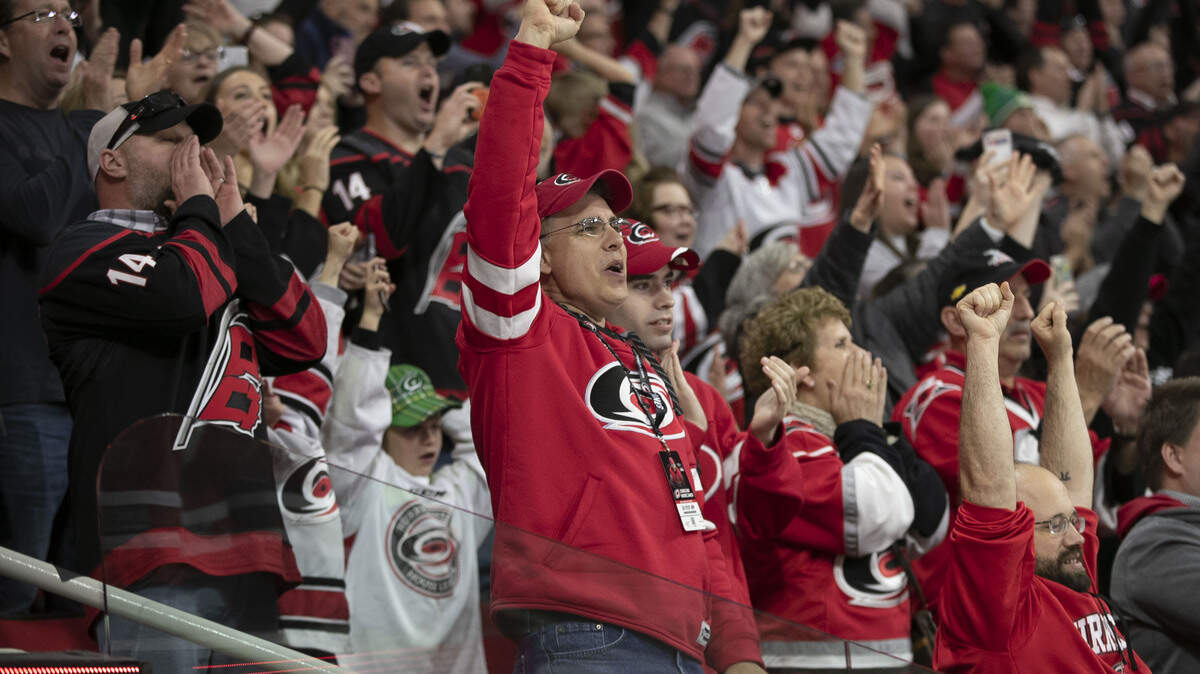 Fans rejoice as time expires and the Carolina Hurricanes top New Jersey 3-1 clinching a playoff spot for the first time since 2009 on Thursday, April 4, 2019 at the PNC Arena in Raleigh, N.C.