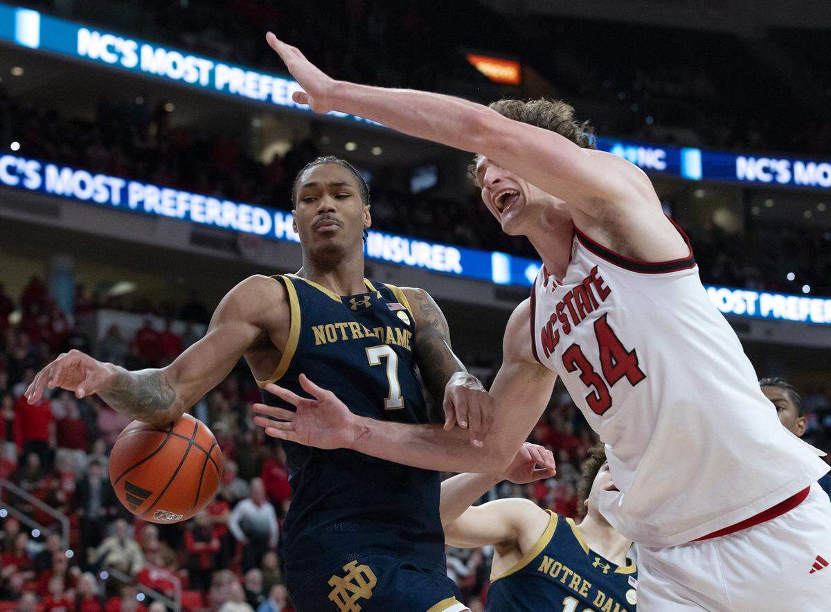 N.C. State’s Ben Middlebrooks is fouled by Notre Dame’s Tae Davis in the closing seconds of the Wolfpack’s 66-65 win on Wednesday, Jan. 8, 2025, at Lenovo Center in Raleigh, N.C.