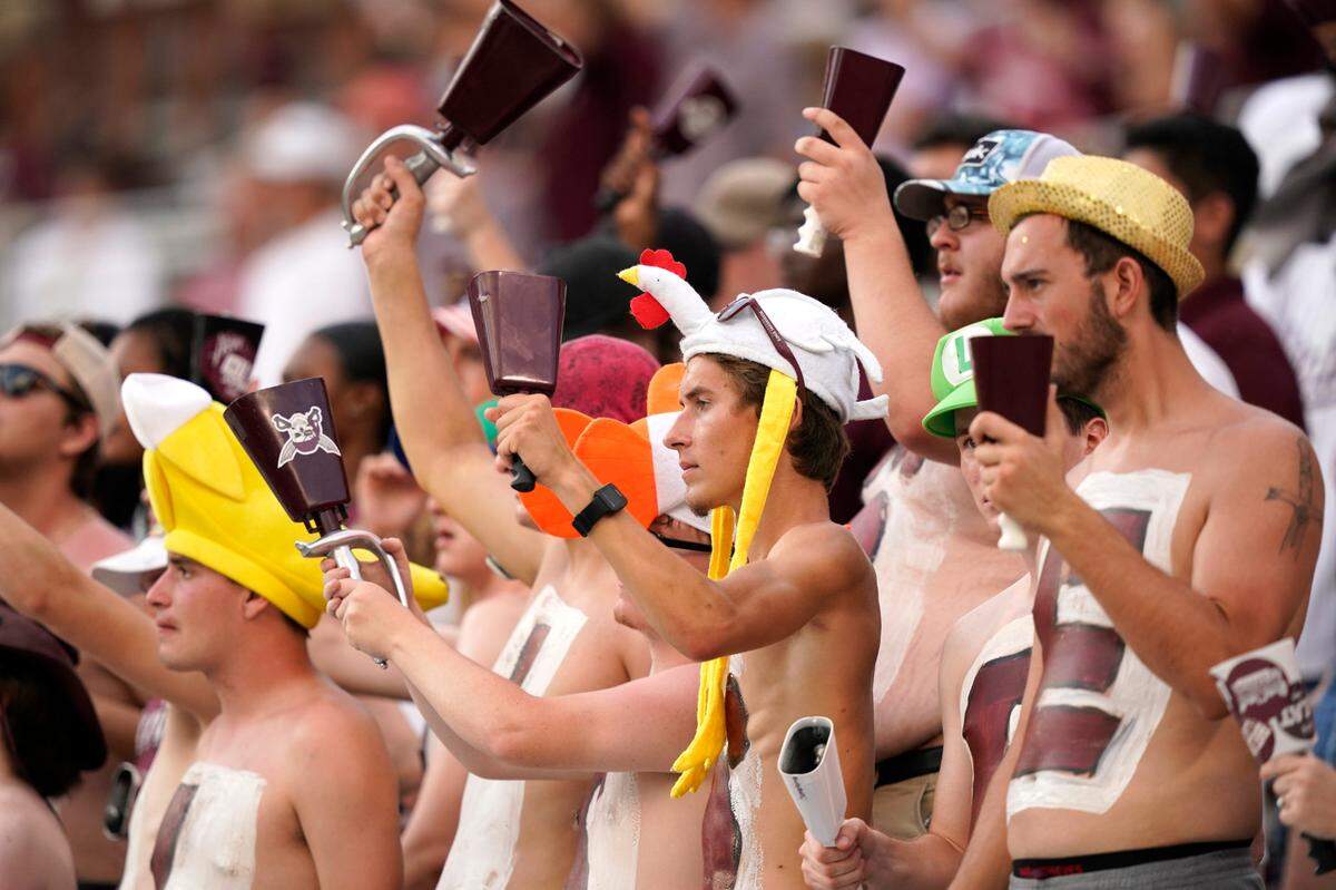 Mississippi State students ring their cowbells as they cheer on their team during the second half of an NCAA college football game against Louisiana Tech in Starkville, Miss., Saturday, Sept. 4, 2021. Mississippi State won 35-34.