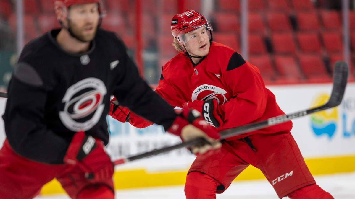 Carolina Hurricanes right win Jackson Blake (53) skates with Jaccob Slavin (74) during practice as they prepare for their Stanley Cup series against the Washington Capitals on Friday, May 2, 2025 at Lenovo Center in Raleigh, N.C.