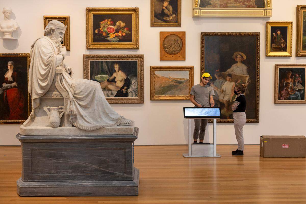 “Saul under the influence of the Evil Spirit,” a sculpture by William Wetmore Story, is surrounded by a fresh installation of paintings and a new digital label kiosk, on Tuesday, September 20, 2022 in Raleigh, N.C.