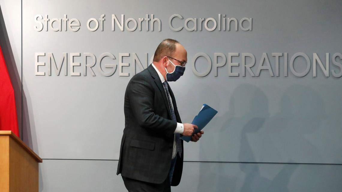Charlie Perusse, the North Carolina state budget director, walks off the stage after speaking at the Emergency Operations Center in Raleigh, N.C., Thursday, February 4, 2021.