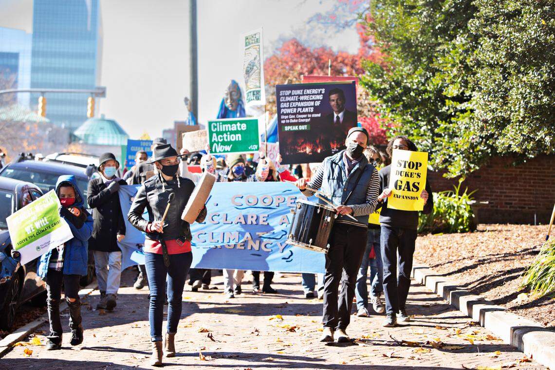 Protestors march around the Governor’s Mansion in Raleigh on Friday, Nov. 19, 2021, during a protest about the climate. Seventeen groups around the state gathered to protest Duke Energy’s plans to build 50 gas-burning power units.