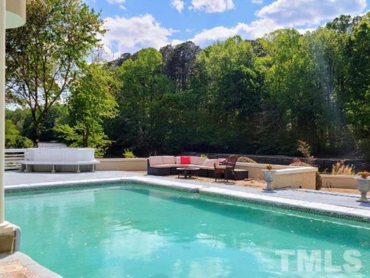 Located in the Lochmere golf and tennis community in Cary, this estate at 107 Headlands Lane sits on one acre where pool and water views can be seen from every room in the house, according to its real estate listing.
