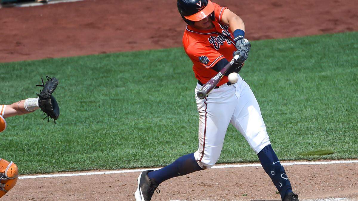 Virginia’s Jake Gelof drives in a run against Tennessee at TD Ameritrade Park in June 2021. Saturday, Gelof set a Virginia single-season home run record in leading the Cavaliers to a super regional win over Duke in Charlottesville, Virginia.