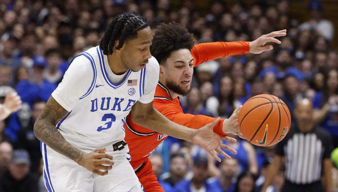 Duke’s Isaiah Evans (3) goes for the ball with Virginia's Sam Lewis (5) during the first half of Duke’s game against Virginia at Cameron Indoor Stadium in Durham, N.C., Saturday, Feb. 28, 2026.