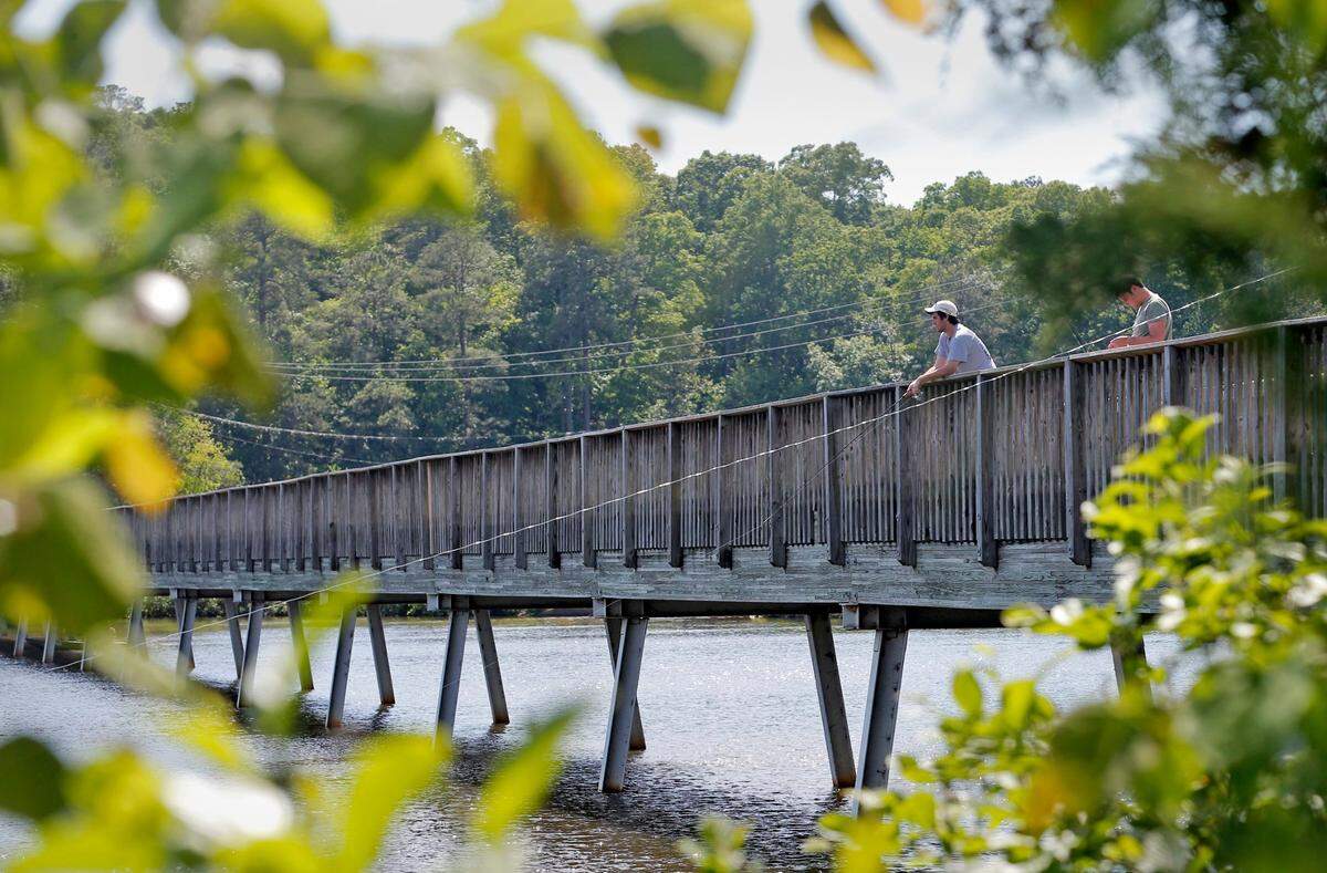 Harrison Cole, left, and Ben Leeds time fishing on Lake Johnson in Raleigh in a May 2015 file photo.