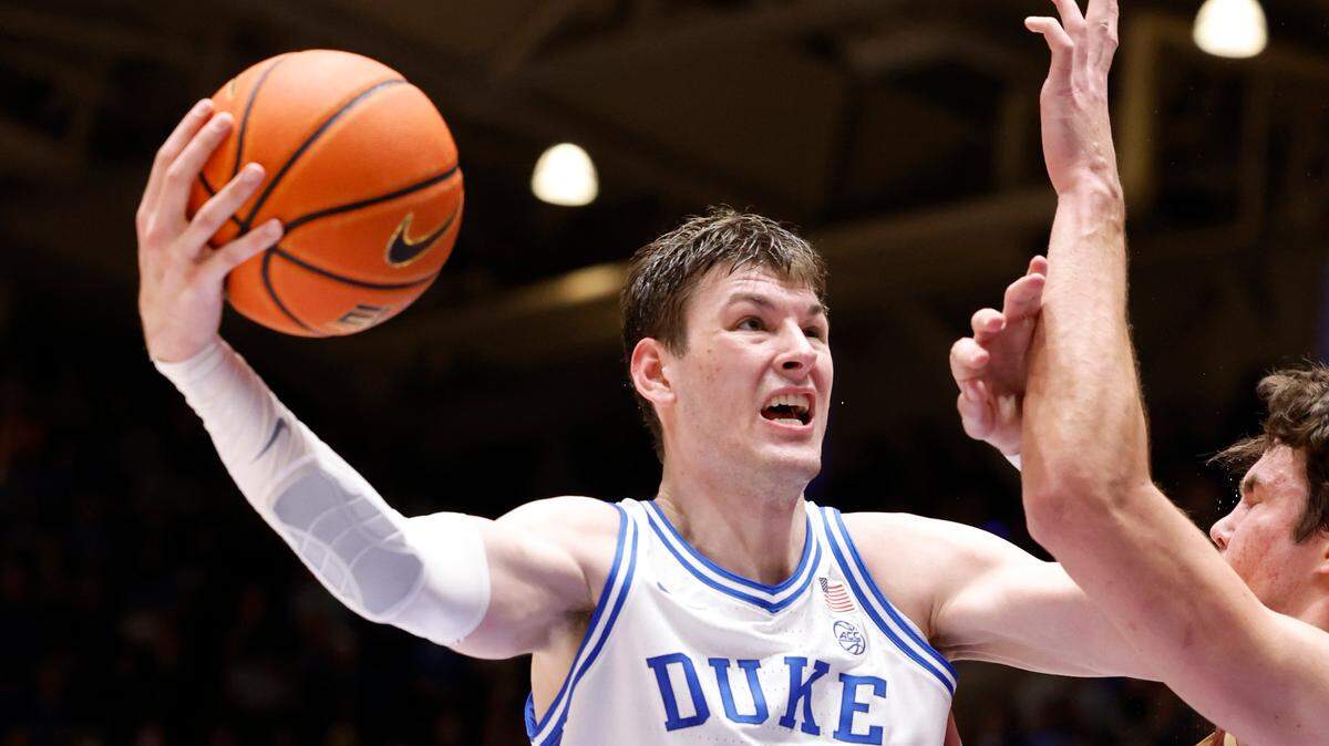 Duke’s Kyle Filipowski (30) shoots as Boston College’s Quinten Post (12) defends during the first half of Duke’s game against Boston College at Cameron Indoor Stadium in Durham, N.C., Saturday, Feb. 10, 2024.