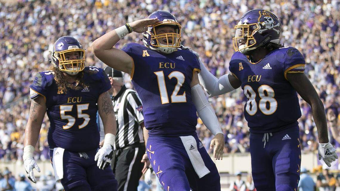 East Carolina quarterback quarterback Colton Ahlers (12) salutes the crowd after scoring a touchdown in the second quarter against North Carolina on Saturday, September 8, 2018 at Dowdy-Ficklen Stadium in Greenville, N.C.