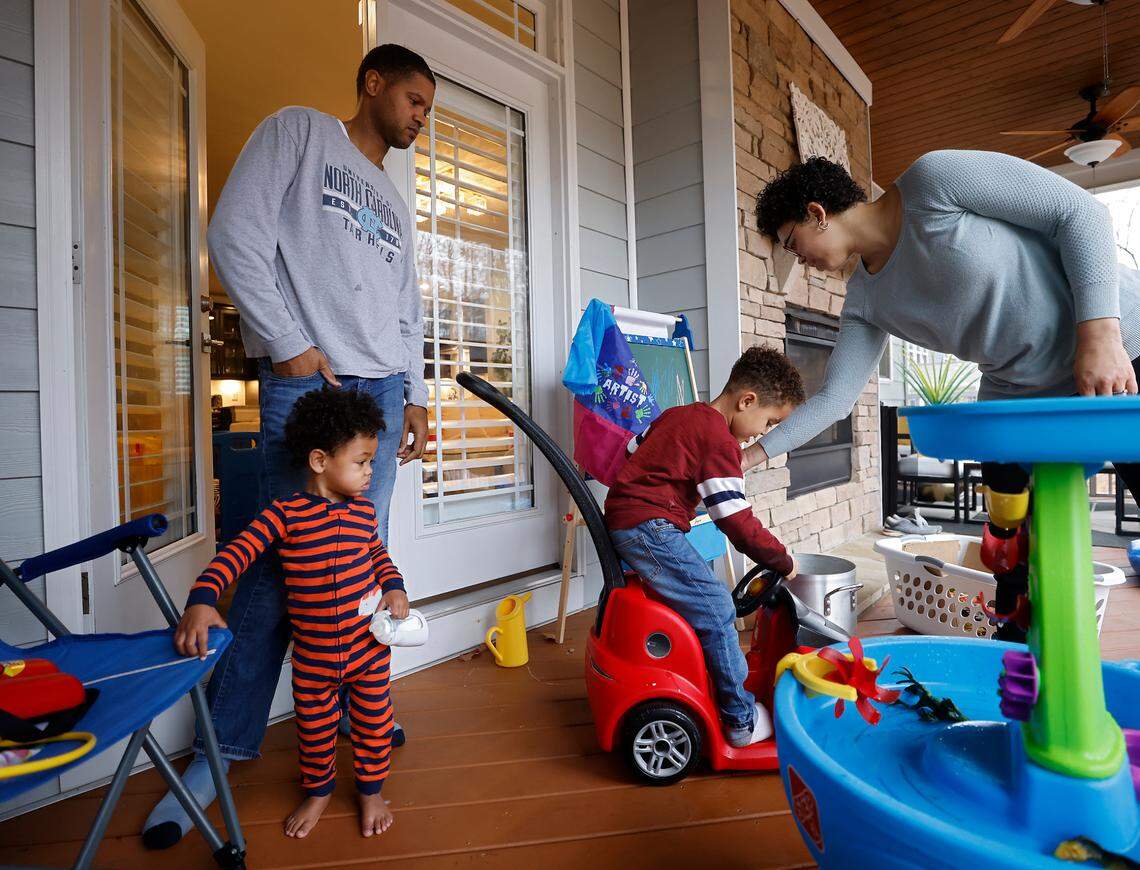 Brian Wasson and Ashly Gaskin-Wasson care for their two children, Channing, 1 and London, 4, both of whom are battling symptoms of upper respiratory illness, at home in Durham, N.C. on Wednesday, Dec. 7, 2022.