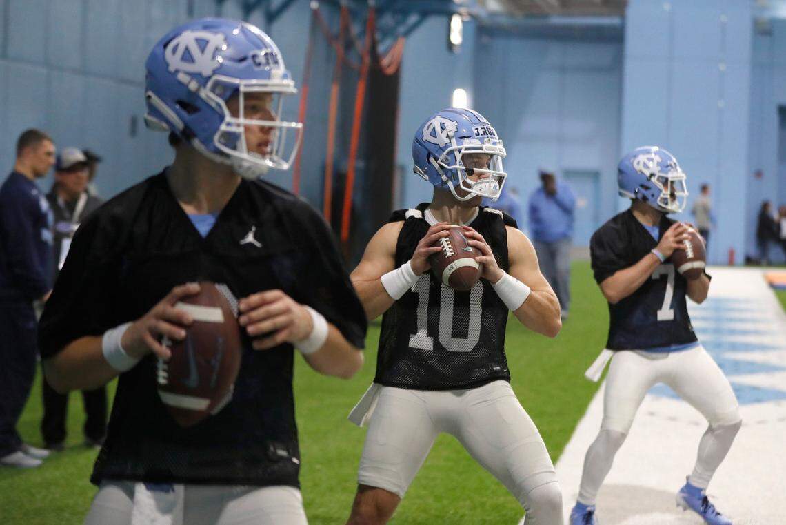 From left, North Carolina quarterbacks Cade Fortin (6), Jace Ruder (10) and Sam Howell (7) run drills during UNC’s first spring football practice in Chapel Hill, N.C., Sunday, March 3, 2019.