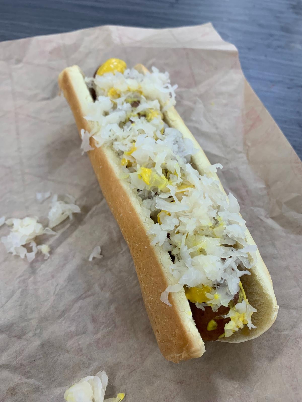 Sam’s Club has a hot dog condiment bar with sauerkraut and mustard.