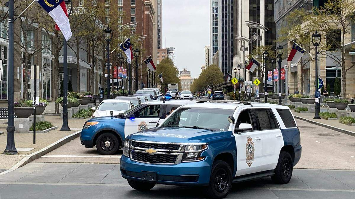 Raleigh police vehicles block the 500 block of Fayetteville Street in downtown Raleigh in 2024.