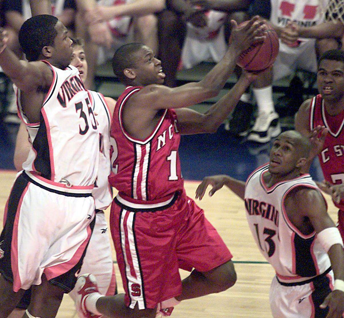 N.C. State’s Justin Gainey drives to the basket during their game against Virginia in 2000. 