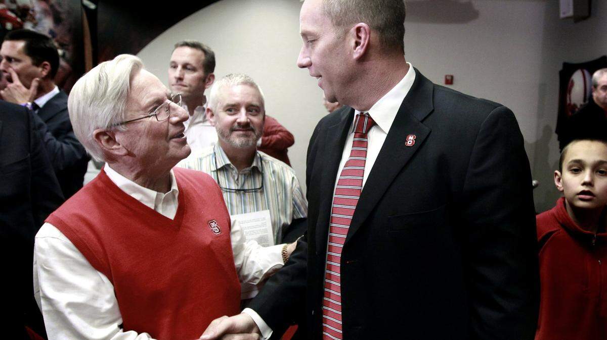 Wendell Murphy, left, greets Dave Doeren after a press conference where Doeren was introduced as N.C. State’s new head football coach Sunday, December 2, 2012, at the Wendell H. Murphy Football Center in Raleigh, N.C.