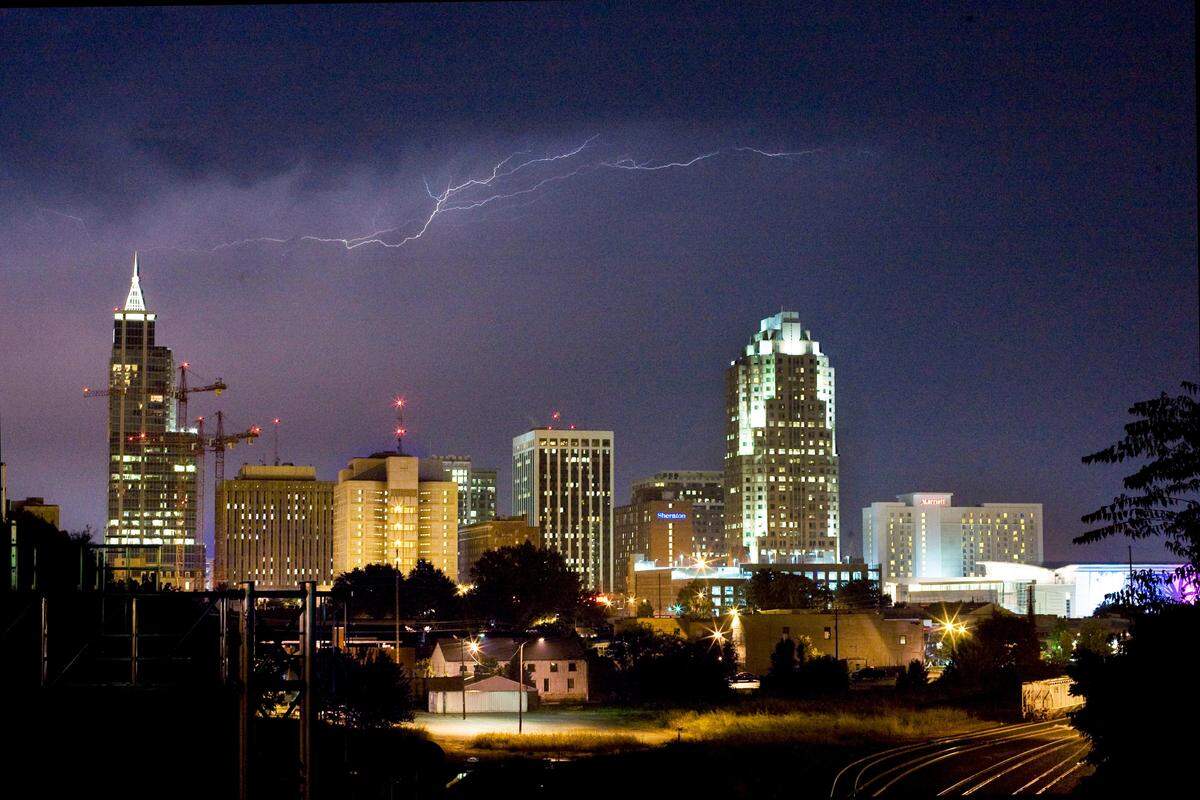 Lightning dances over Raleigh's skyline during a summer thunderstorm. 
