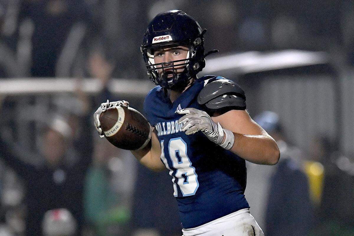 Millbrook's Hayes Brawner (18) looks to the referee after recovering the ball for the touchdown against Jordan during the first half. The Millbrook Wildcats and the Jordan Falcons met in the third round of the NCHSAA 8A football playoffs in Raleigh, N.C. on November 21, 2025. 