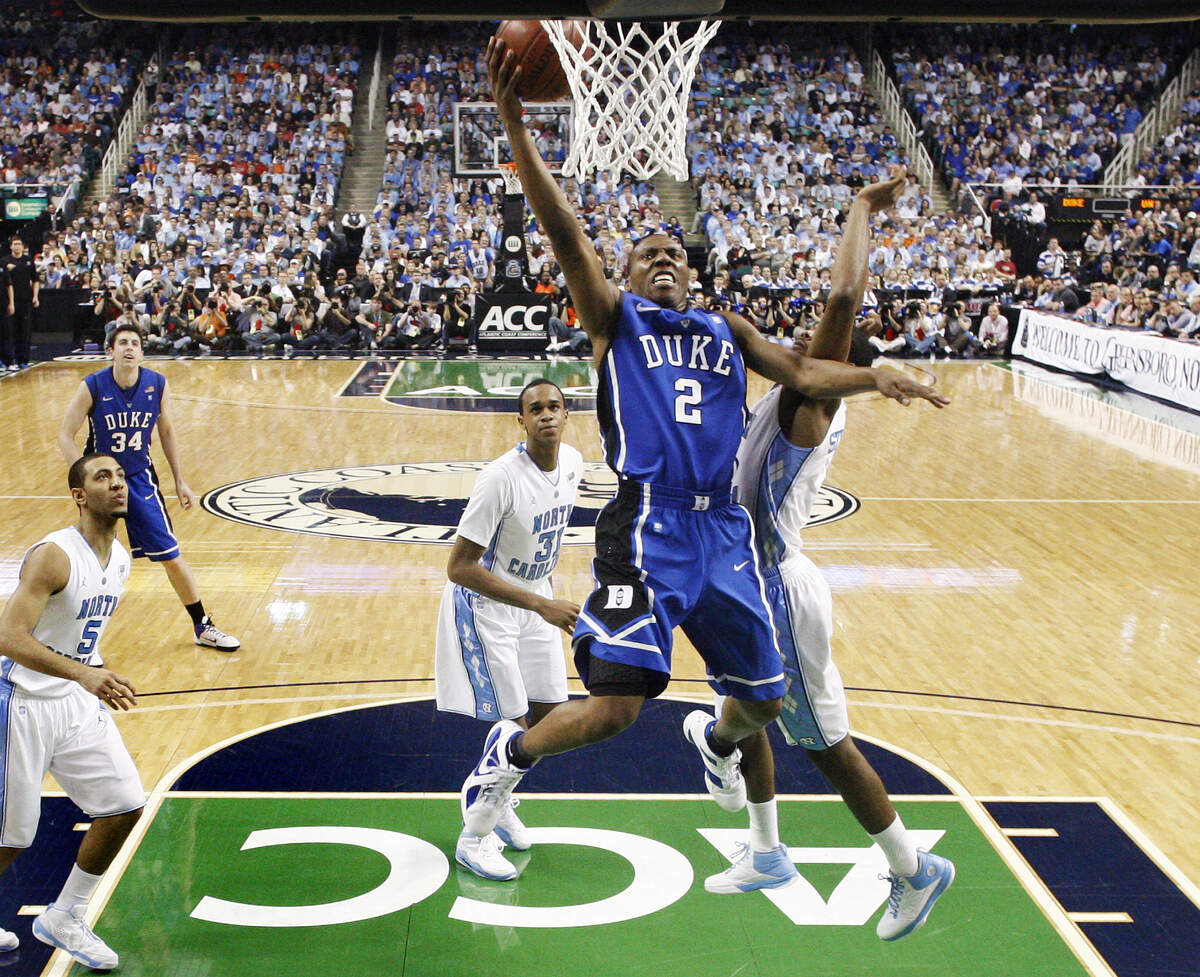Duke’s Nolan Smith (2), who had a double-double with 20 points and 10 assists, drives to the basket past UNC’s Dexter Strickland. Ethan Hyman - ehyman@newsobserver.com